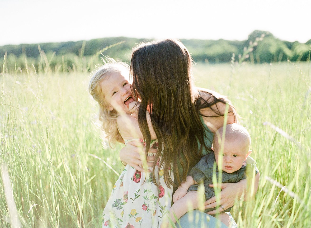 mom and daughter and son in field