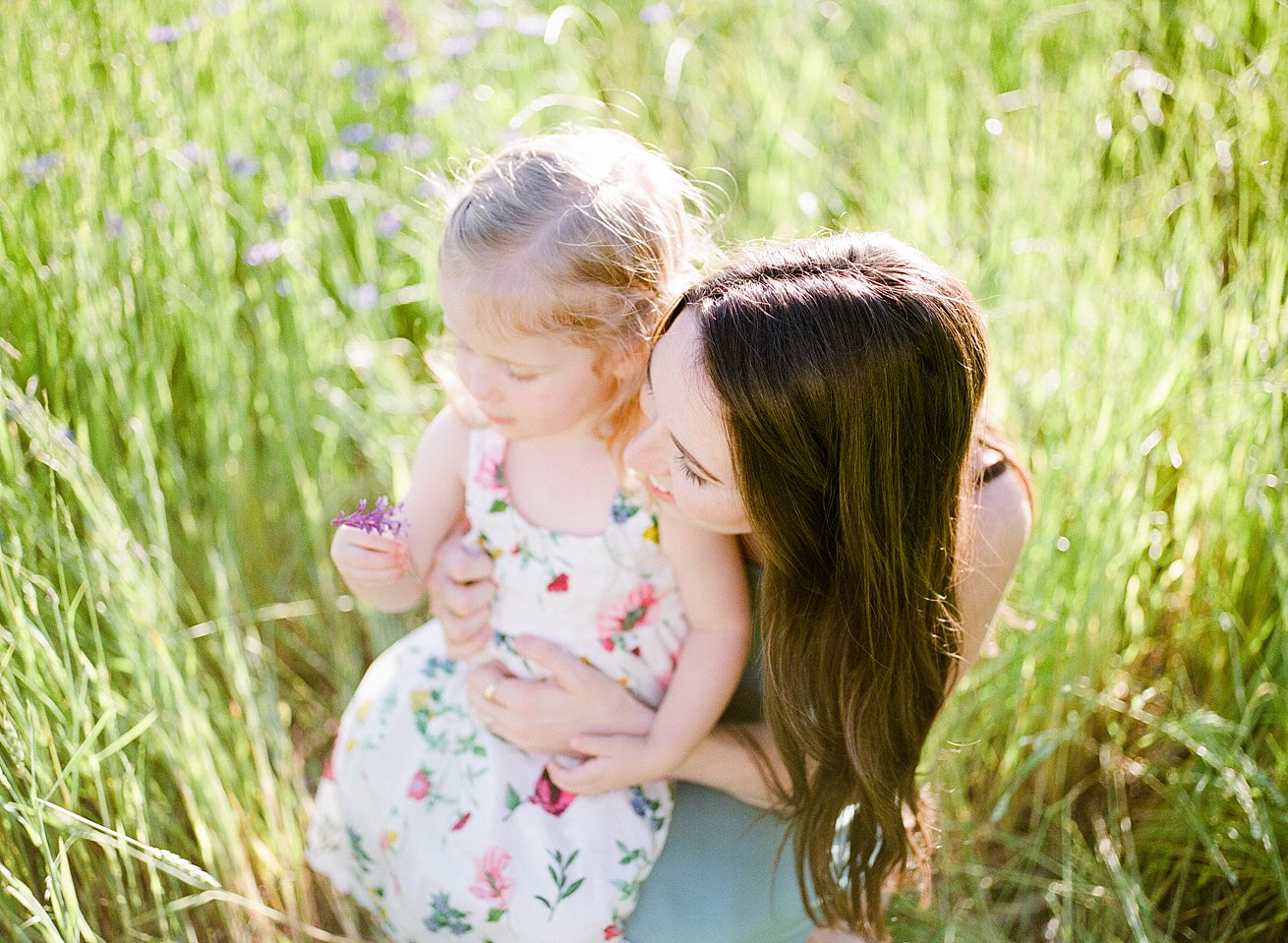 mother daughter on film in field