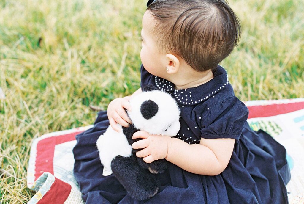 baby girl with stuffed animal