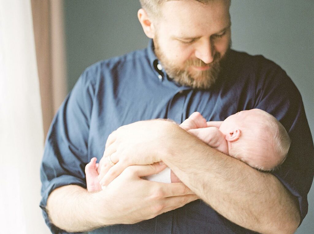 father and son, newborn, at home