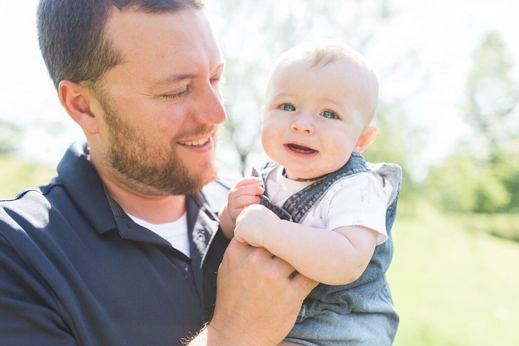 father and son, smiling baby, natural light