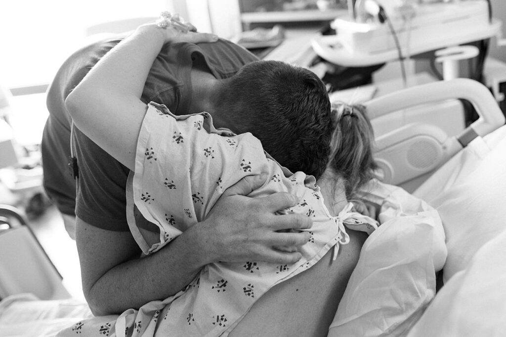 mom and dad hugging during labor