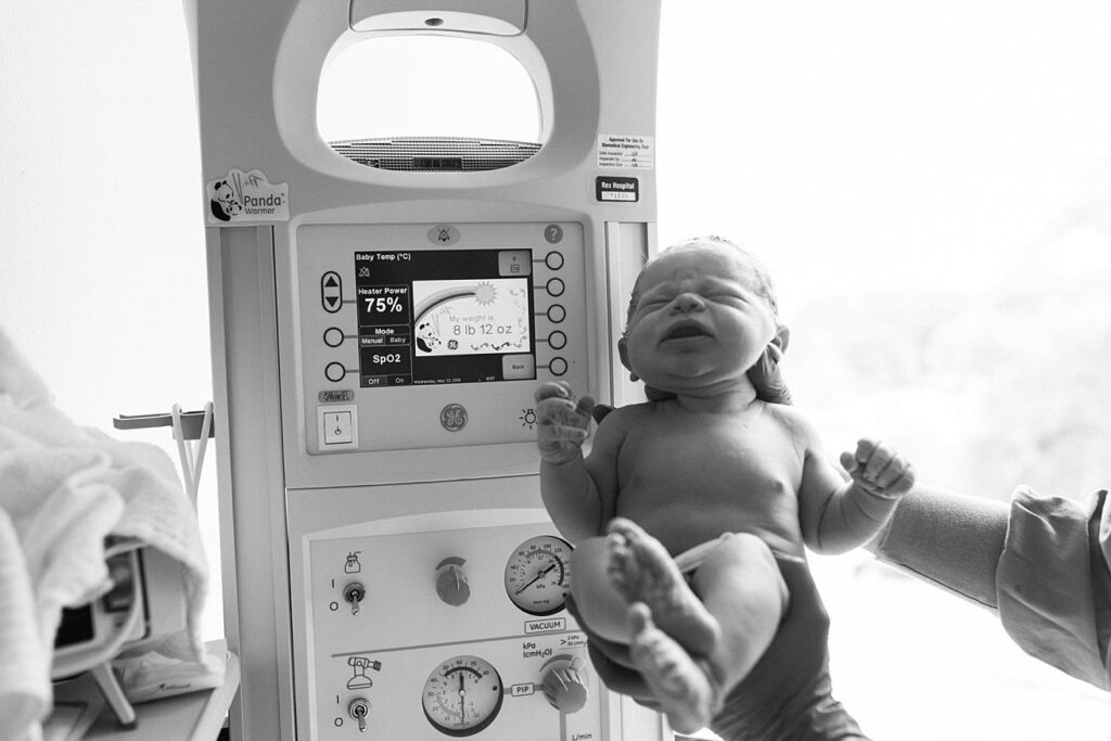baby boy being weighed at hospital