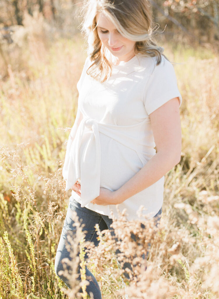 pregnant mom in a field