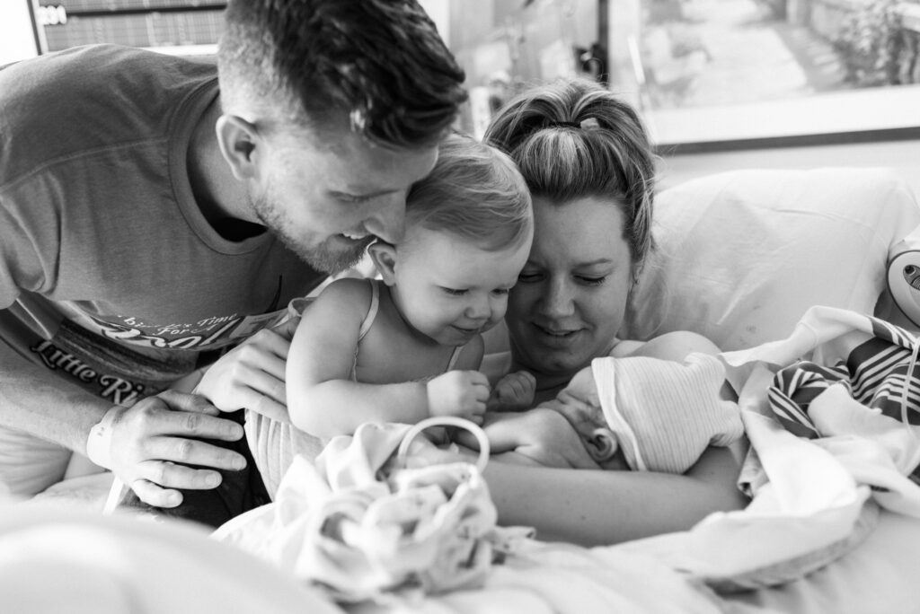 family of four, newborn baby boy in hospital