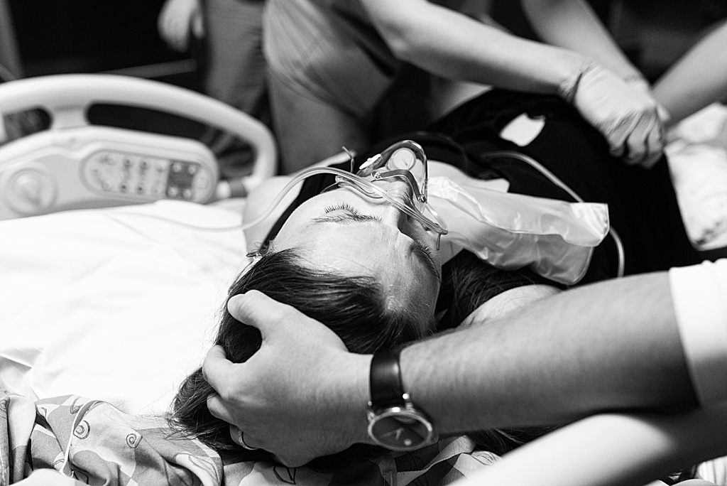 mom in labor at the hospital with oxygen mask