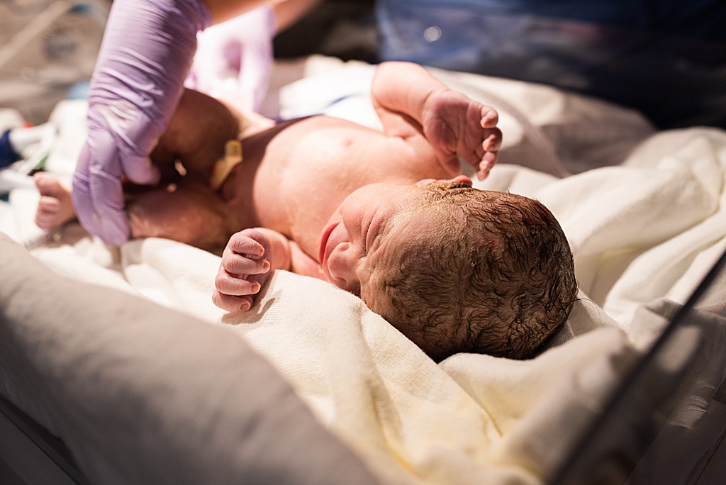 baby girl in hospital bassinet