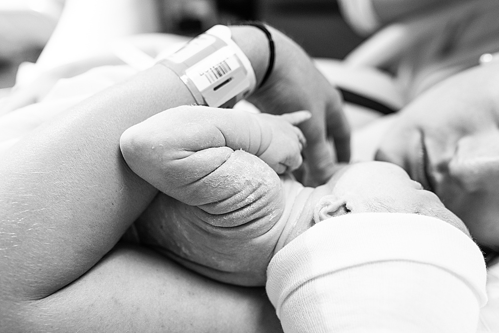 baby rolls on arms in hospital