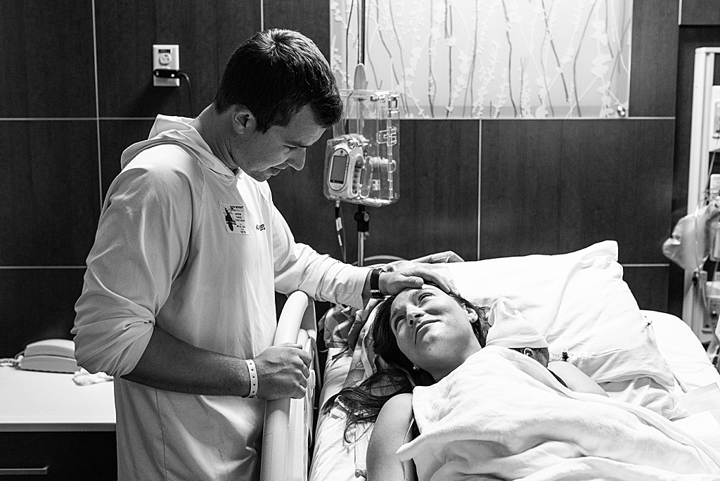 mom and dad looking at each other in hospital