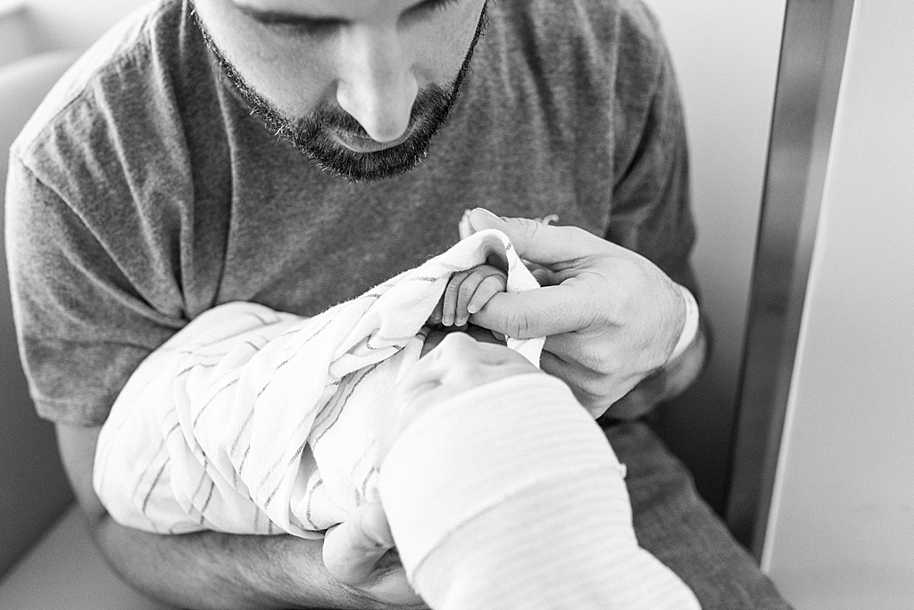 baby holding dad's finger, hospital birth