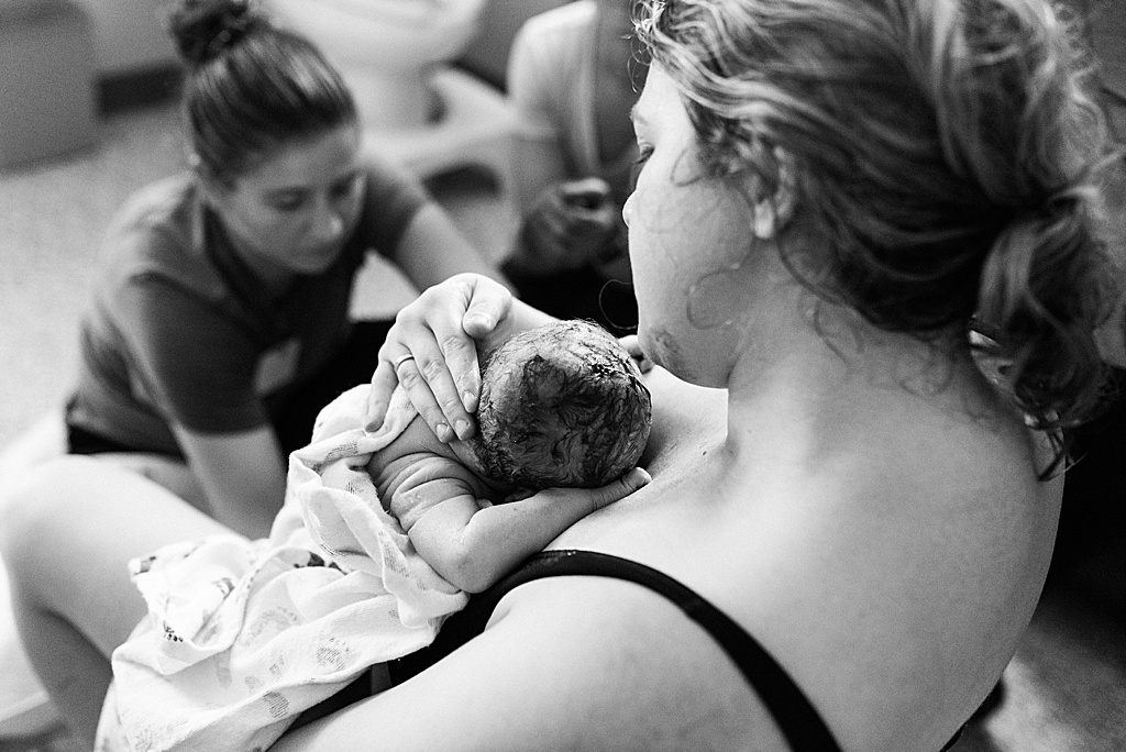 mom holding baby after birth
